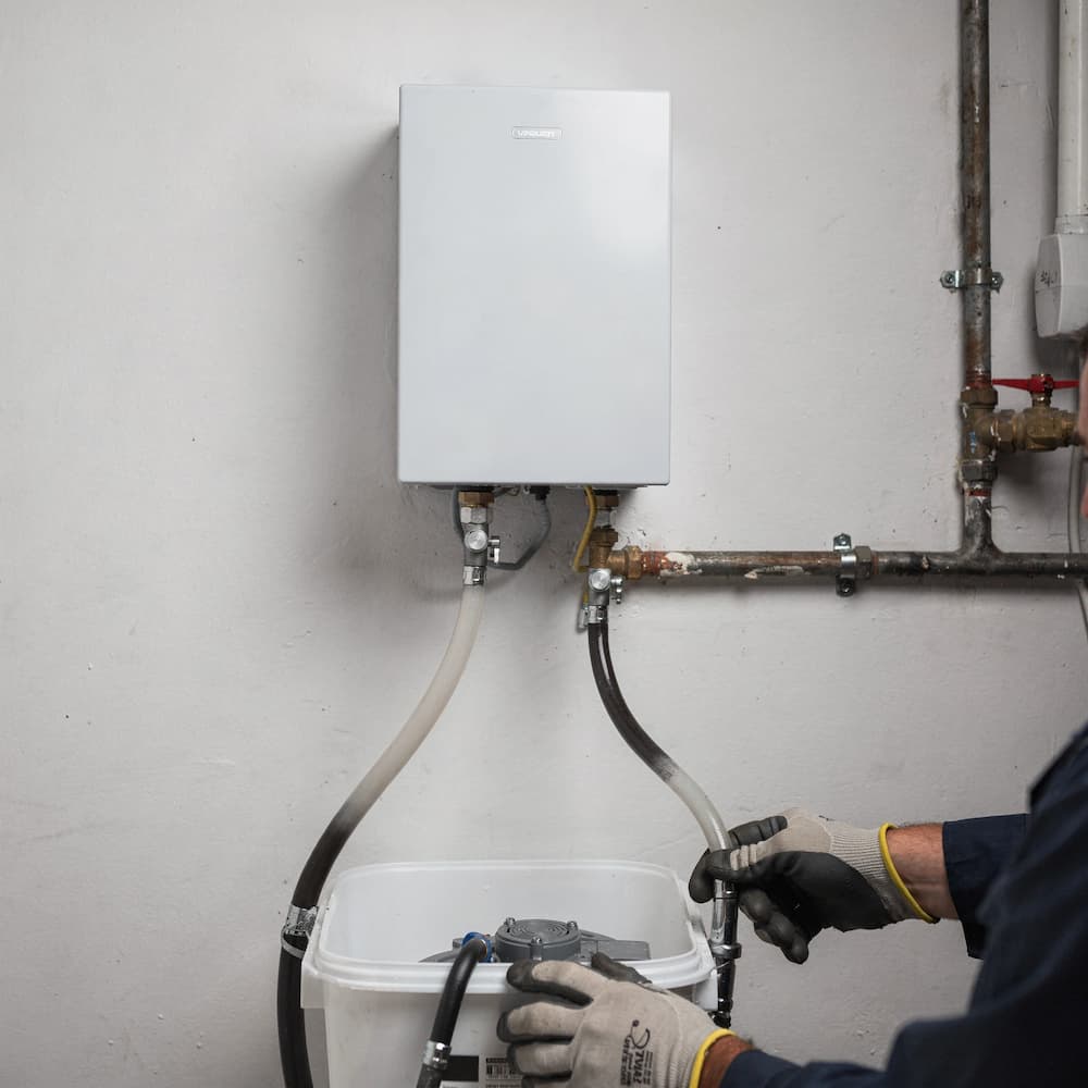 Tankless water heater flushing setup after replacement in Boston